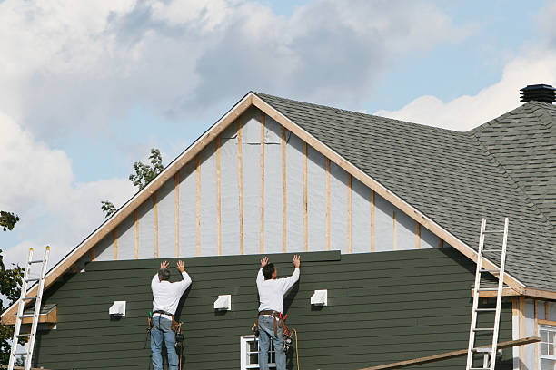 Professional Siding technician working in Louisville, CO